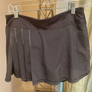 Athleta lined skort in gray with partial pleats in front